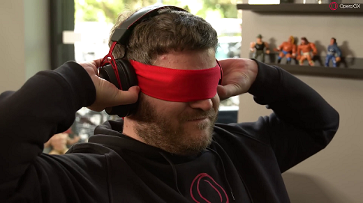 Sven putting on his headset, he is wearing a red blindfold.